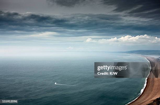 chesil beach - sail boat at sea stock pictures, royalty-free photos & images