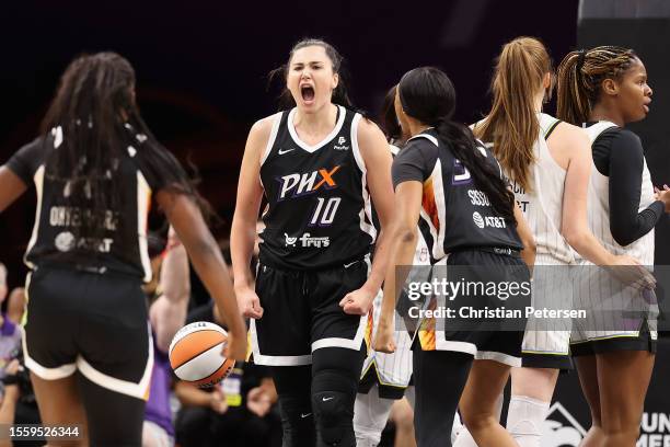 Megan Gustafson of the Phoenix Mercury reacts after scoring and drawing a foul against the Chicago Sky during the first half of the WNBA game at...