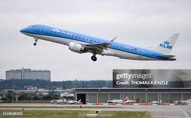 An Embraer 190 Cityhopper passenger plane of Dutch airline KLM takes off from Stuttgart Airport in Leinfelden-Echterdingen near Stuttgart,...