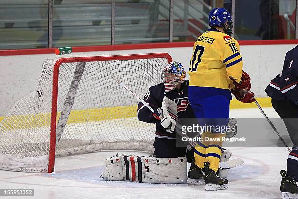 Thatcher Demko of the USA is scored on by Robert Hagg of Sweden as teammate Rasmus Fyrpihl sets up in front during the U-18 Four Nations Cup on...