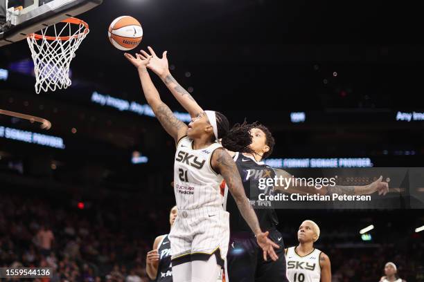 Robyn Parks of the Chicago Sky lays up a shot past Brittney Griner of the Phoenix Mercury during the first half of the WNBA game at Footprint Center...