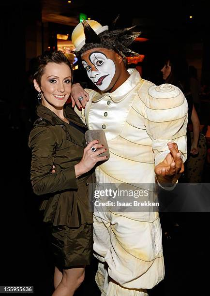 Actress Erica Linz appears with a "Zarkana by Cirque du Soleil" character at the reception for the Las Vegas premiere of "Zarkana by Cirque du...