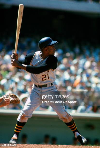 Outfielder Roberto Clemente' of Pittsburgh Pirates bats against the Los Angeles Dodgers during an Major League Baseball game circa 1965 at Dodger...
