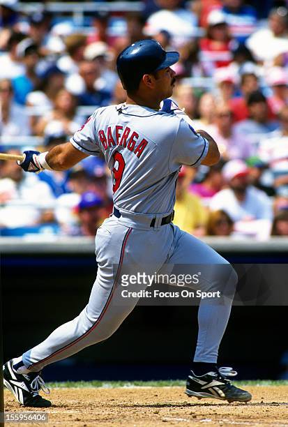 Carlos Baerga of the Cleveland Indians bats against the New York Yankees during an Major League Baseball game circa 1994 at Yankee Stadium in the...
