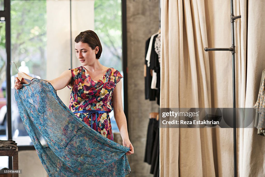 Customer admires dress
