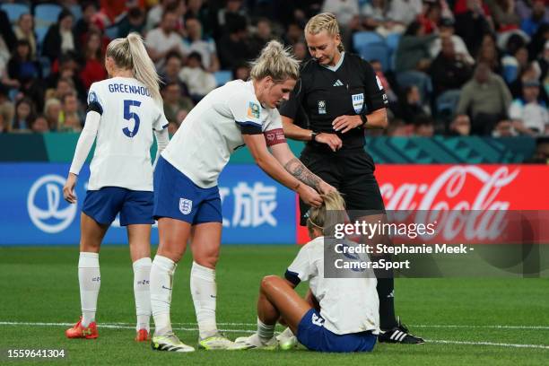 England's Millie Bright helps teammate Rachel Daly after she is fouled during the FIFA Women's World Cup Australia & New Zealand 2023 Group D match...