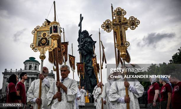 Russian Orthodox clergy participates in a procession and a prayer service marking the 1035th anniversary of the Baptism of Rus, the ancient word for...