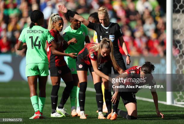 Christine Sinclair of Canada is consoled by Jordyn Huitema after her penalty kick is saved during the FIFA Women's World Cup Australia & New Zealand...