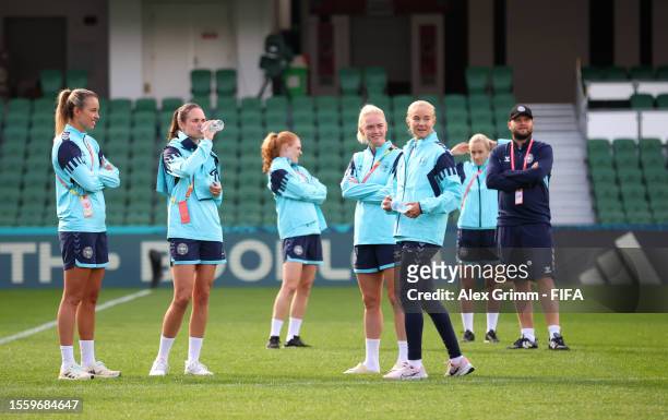 Players of Denmark inspect the pitch during a Denmark Stadium Familiarisation at Perth Rectangular Stadium on July 21, 2023 in Perth / Boorloo,...