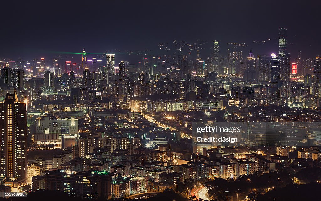 Illuminated city skyline of Kowloon and Hong Kong