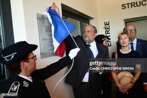 French Justice Minister Eric Dupond-Moretti unveils a plaque as he inaugurates a centre for rehabilitating former inmates in Le Pontet, near Avignon,...