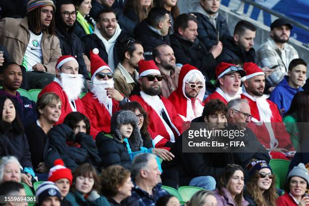 Fans clad Santa Claus costumes are seen during the FIFA Women's World Cup Australia & New Zealand 2023 Group B match between Nigeria and Canada at...