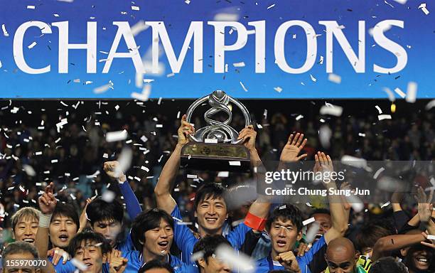 Kwak Tae-Hwi of Ulsan Hyundai and other players celebrate with the AFC Champions League Final Tropy after winning the 2012 AFC Champions League final...