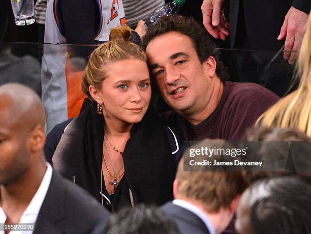 Mary-Kate Olsen and Olivier Sarkozy attend the Dallas Mavericks vs New York Knicks game at Madison Square Garden on November 9, 2012 in New York City.