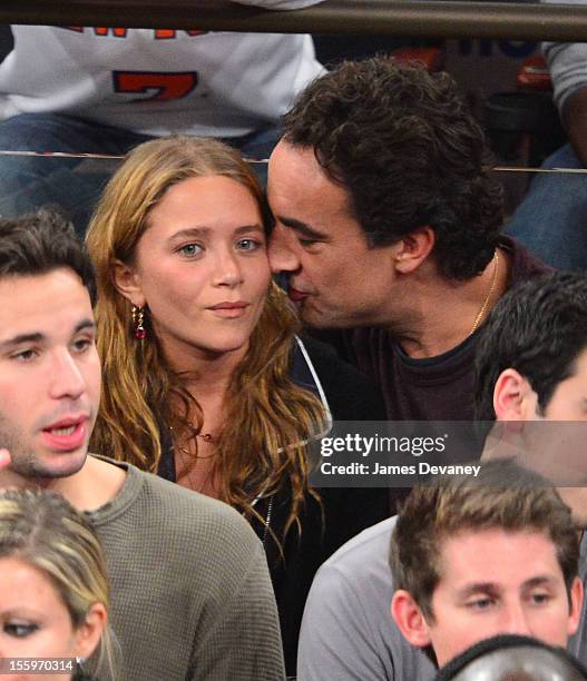 Mary-Kate Olsen and Olivier Sarkozy attend the Dallas Mavericks vs New York Knicks game at Madison Square Garden on November 9, 2012 in New York City.