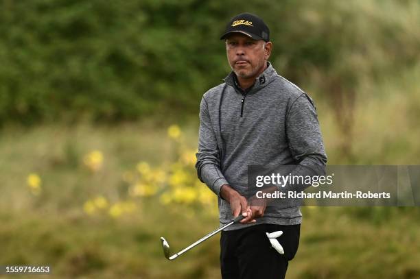 Jeev Milkha Singh of India hits an approach shot during Day Two of The Senior Open Presented by Rolex at Royal Porthcawl Golf Club on July 28, 2023...