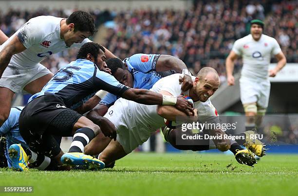 Charlie Sharples of England crashes ovwer the line to score the opening try during the QBE international match between England and Fiji at Twickenham...