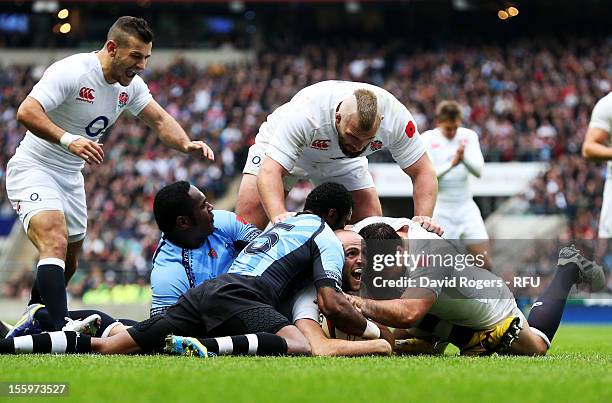 Charlie Sharples of England celebrates after scoring the opening try during the QBE international match between England and Fiji at Twickenham...