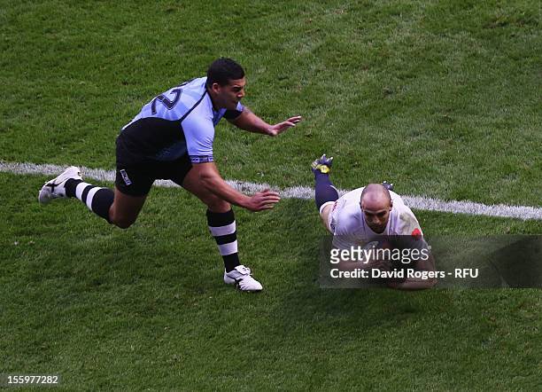 Charlie Sharples of England dives to score a try during the QBE international match between England and Fiji at Twickenham Stadium on November 10,...