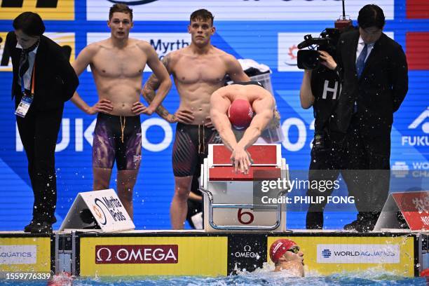 Britain's Tom Dean dives in during the final of the men's 4x200m freestyle relay swimming event during the World Aquatics Championships in Fukuoka on...