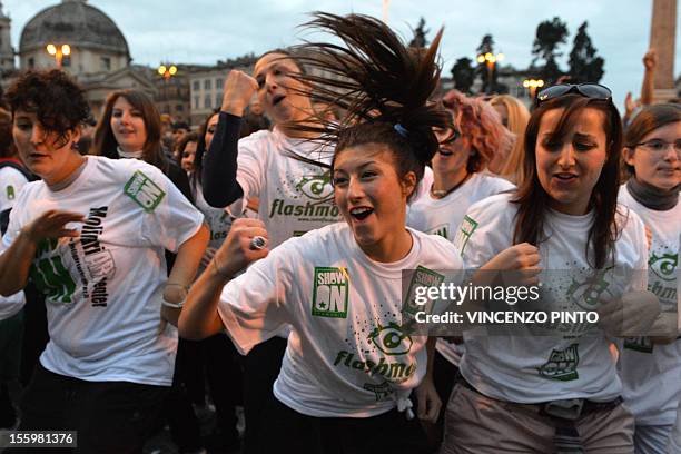 People dance on the 'Gangnam style' song during a flashmob organized at Piazza del Popolo on November 10, 2012 in Rome. Some 5000 people, most of...