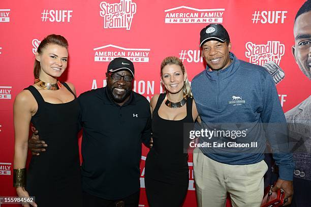 Eddie Levert and Tony Cornelius pose for a photo with two models at the First Annual Soul Train Celebrity Golf Invitational on November 9, 2012 in...