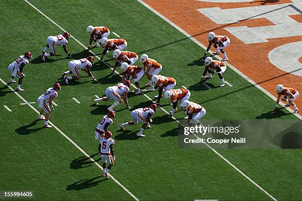 The Texas Longhorns line up in the wishbone formation for the first play in honor of Darrell K Royal during the Big 12 Conference game against the...