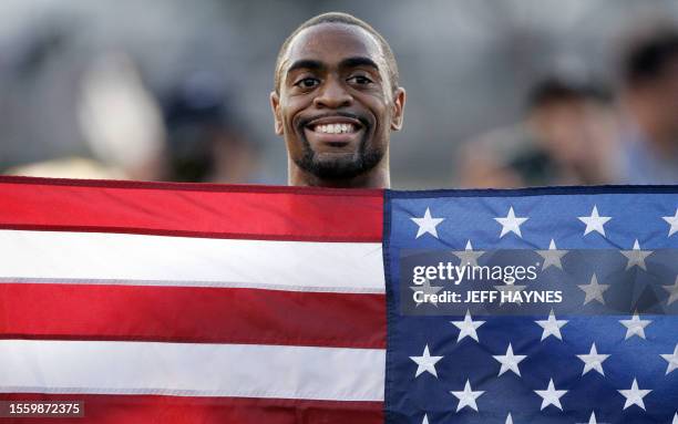 Tyson Gay of the US celebrates after winning the Men's 100 Meter Dash during the 2007 AT&T US Outdoor Track and Field Championships 22 June 2007 at...