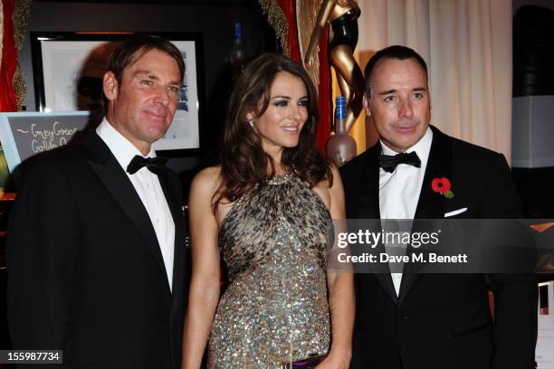 Actress Elizabeth Hurley , David Furnish and ex-cricketer Shane Warne arrive at the Grey Goose Winter Ball at Battersea Power Station on November 10,...