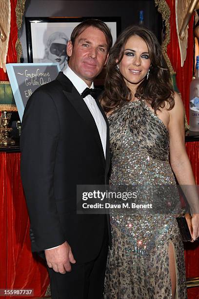 Actress Elizabeth Hurley and ex-cricketer Shane Warne arrive at the Grey Goose Winter Ball at Battersea Power Station on November 10, 2012 in London,...