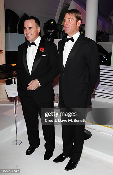 David Furnish and ex-cricketer Shane Warne arrive at the Grey Goose Winter Ball at Battersea Power Station on November 10, 2012 in London, England.