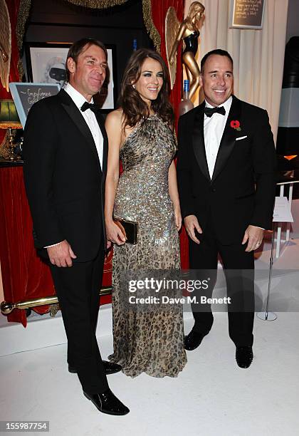 Actress Elizabeth Hurley , David Furnish and ex-cricketer Shane Warne arrive at the Grey Goose Winter Ball at Battersea Power Station on November 10,...