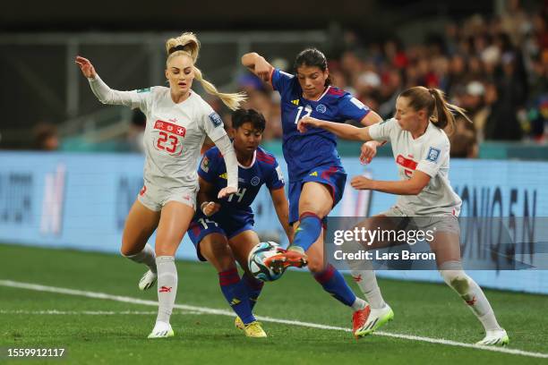 Alicia Barker of Philippines competes for the ball against Alisha Lehmann and Noelle Maritz of Switzerland during the FIFA Women's World Cup...