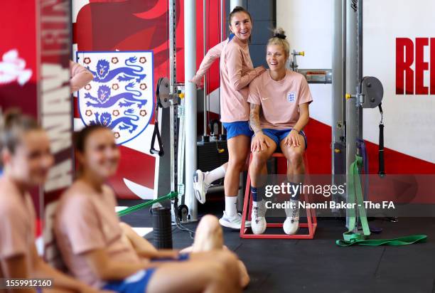 Katie Zelem and Rachel Daly of England react in the gym at Spencer Park on July 21, 2023 in Brisbane, Australia.