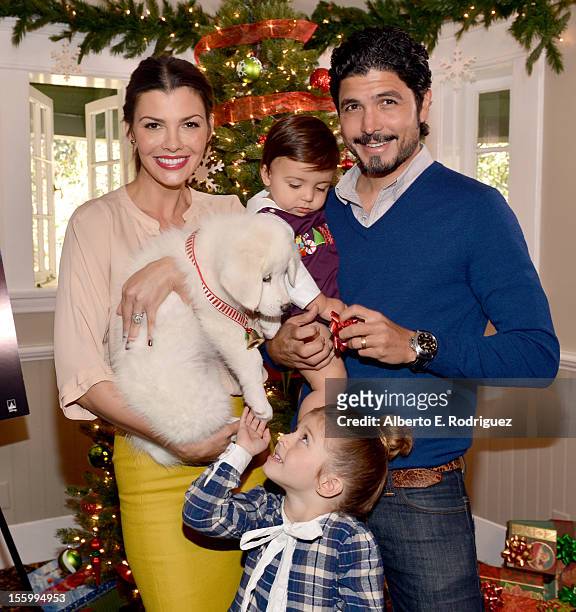 Host Ali Landry, daughter Estela, son Marcelo, and filmmaker Alejandro Gomez Monteverde attend the "Santa Paws 2: The Santa Pups" holiday party...