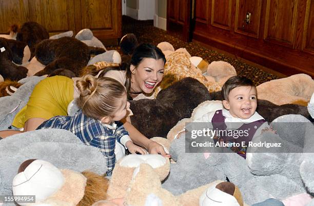 Host Ali Landry with her daughter Estela and son Marcelo attend the "Santa Paws 2: The Santa Pups" holiday party hosted by Disney, Cheryl Ladd, and...