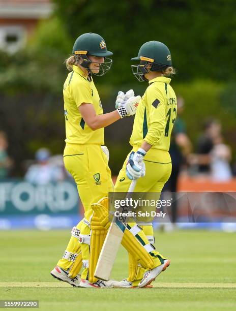 Dublin , Ireland - 28 July 2023; Australia batter Annabel Sutherland, left, is congratulated by teammate Phoebe Litchfield after bringing up her...