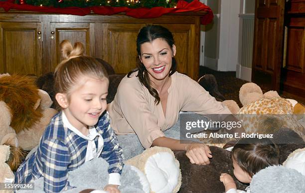 Host Ali Landry with her daughter Estela and son Marcelo attend the "Santa Paws 2: The Santa Pups" holiday party hosted by Disney, Cheryl Ladd, and...