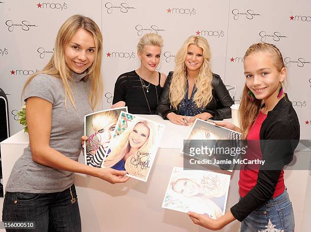Ashlee Simpson and Jessica Simpson pose with fans while they visit Macy's South Coast Plaza in support of the Jessica Simpson and Jessica Simpson...