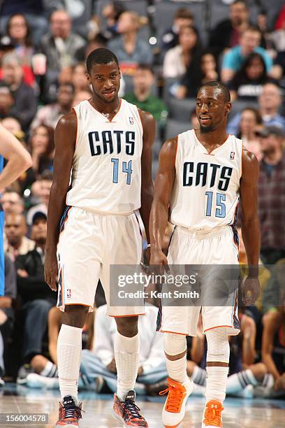 Michael Kidd-Gilchrist and Kemba Walker of the Charlotte Bobcats during the game against the Dallas Mavericks at the Time Warner Cable Arena on...