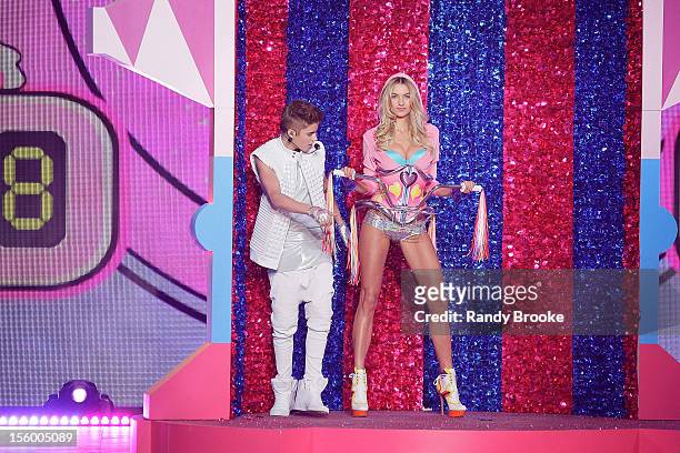 Justin Bieber checks out VS Model Jessica Hart as she walks the runway during the 2012 Victoria's Secret Fashion Show at the Lexington Avenue Armory...