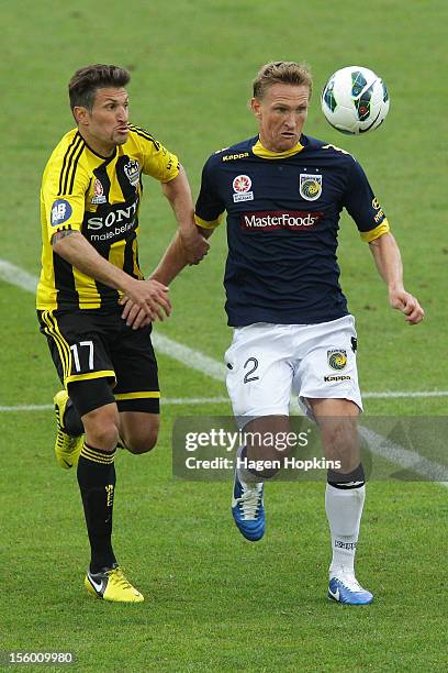 Vince Lia of the Phoenix and Daniel McBreen of the Mariners compete for the ball during the round six A-League match between the Wellington Phoenix...