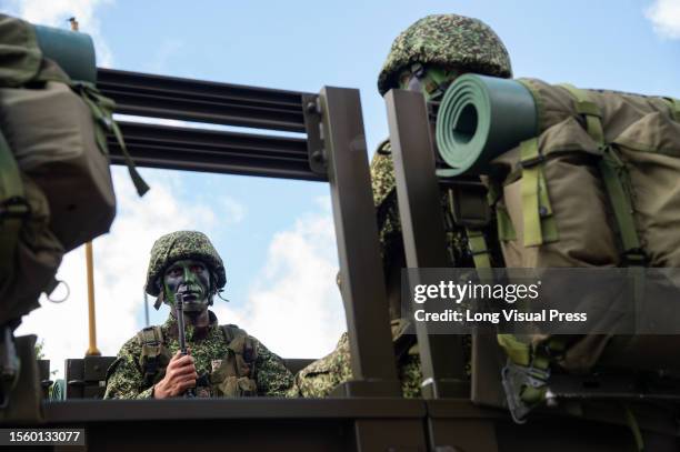 Colombian navy soldier is seen in a military transport truck during the military parade for the 213 years of Colombia's independence, in Bogota, July...