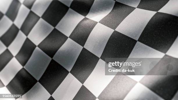 waving racing finish flag with checkered pattern texture in slow motion - lap circuit stockfoto's en -beelden