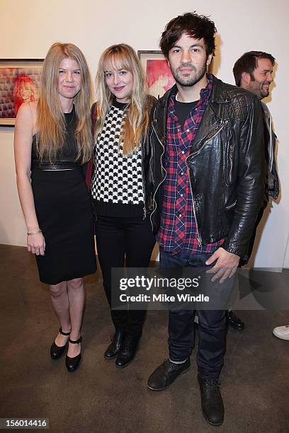 Artist Vanessa Prager, actress Dakota Johnson and actor Jordy Masterson pose during "HOURS" New Drawing Show Hosted By Amanda De Cadenet at Richard...