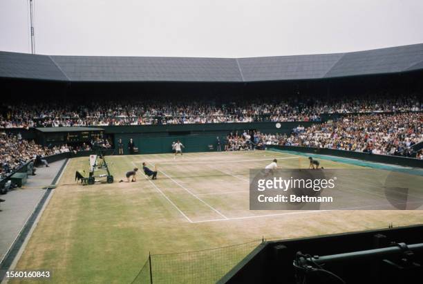 Arthur Ashe and Jimmy Connors competing in the men's singles final of the Wimbledon Tennis Championships in London, July 5th 1975.