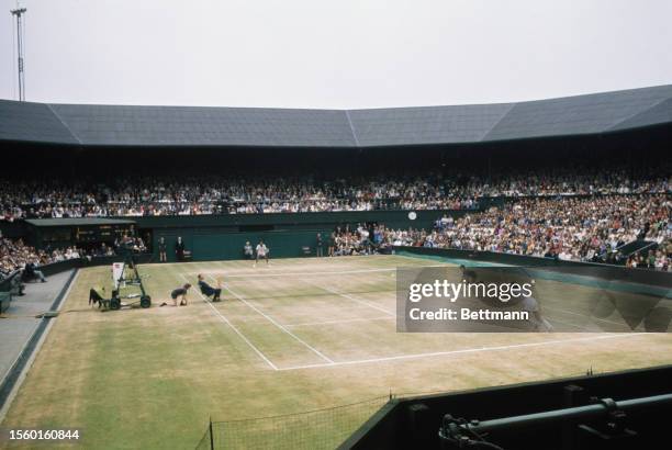 Tennis players Arthur Ashe and Jimmy Connors competing in the men's singles final of the Wimbledon Tennis Championships in London, July 5th 1975.