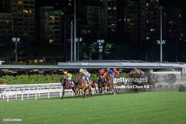 Jockeys compete in the Race 5 Sliver Grecian Handicap at Happy Valley Racecourse on July 12, 2023 in Hong Kong.