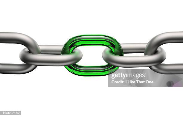 steel chain links connected by a green glass link - a chain is as strong as its weakest link foto e immagini stock