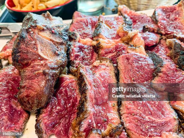 medium rare steak cut in half - rare stock pictures, royalty-free photos & images